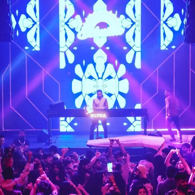On stage during the 'Ethnika Experience' at Sunburn Union, backed by a full AV setup. I offer audio-visual DJ sets for public events to create a more immersive musical experience.