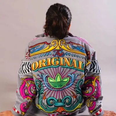 A custom-painted Adidas jacket, created for a collaboration with the brand. I integrated their "The Original" slogan and trefoil logo into a full-back masterpiece of truck art.