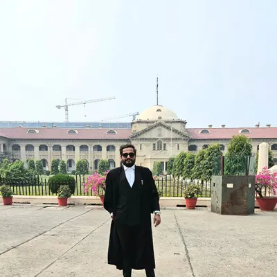Dressed in my advocate's robes outside the courthouse, where I represent the interests of homebuyers. This is the arena where legal arguments are made and rights are defended.