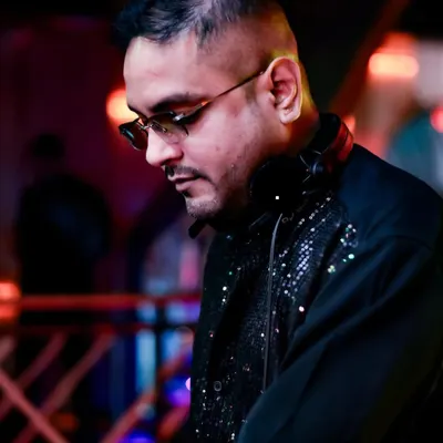 A black and white shot capturing my focus during a set. The sequined jacket adds a bit of sparkle to the intense concentration.