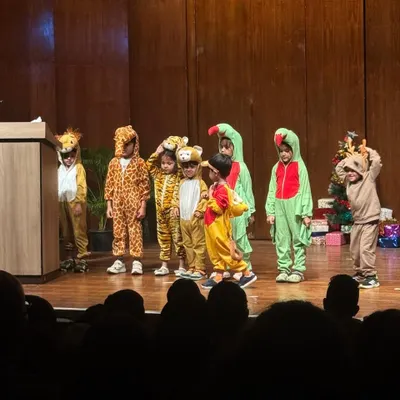 Our youngest performers roar with confidence on stage, bringing our adorable animal kingdom play to life.
