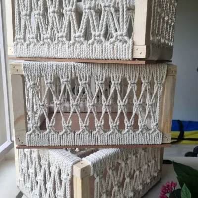 A stack of my multipurpose macrame baskets, ready to be used for gift hampers, home organization, or whatever you can imagine. The wooden frame provides great structure.