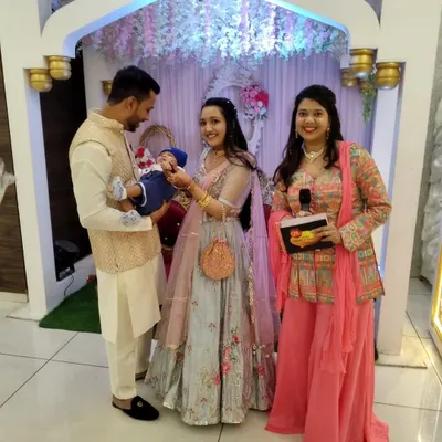 A precious moment with the new parents and their baby during the naming ceremony. As your host, I ensure these key moments are seamless and memorable.