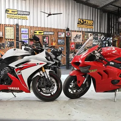 Japanese precision or Italian passion? A Yamaha R1 and a Ducati Panigale V4 side-by-side in our workshop.