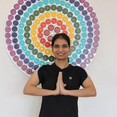 Our trainers are your motivators and mentors. Here, one of our dedicated instructors stands ready to guide you on your wellness journey.