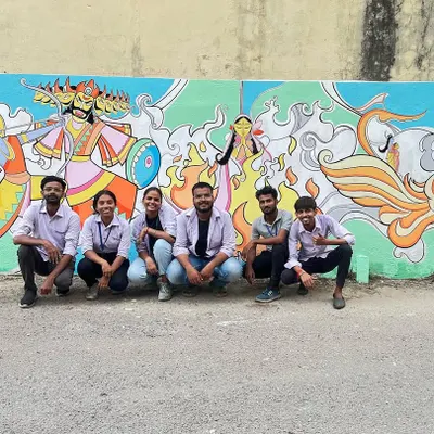This is the completed Ramayan mural my team and I created. It depicts a powerful scene with Lord Rama and Ravana, using bold lines and a rich color palette. This type of traditional Indian wall art is perfect for making a strong cultural statement.