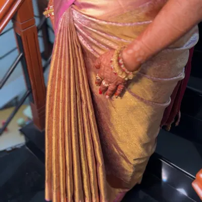 This is my obsession: creating the perfect set of pleats. Notice how each fold is identical in width, creating a beautiful, even cascade on this heavy silk saree.