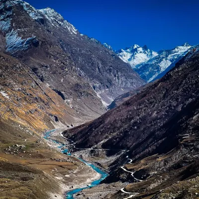 The raw, untamed beauty of Spiti Valley. I used my iPhone for this shot to capture the dramatic contrast between the bright blue river carving its path through the cold, desolate mountain landscape.