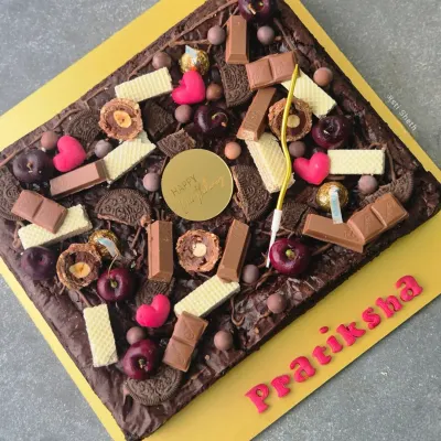 My fudgy and gooey brownie slab is a dream for any chocolate lover. Made with rich coverture chocolate, this egg-free brownie has a perfect crinkled top and can be customized with various toppings for birthdays and celebrations.