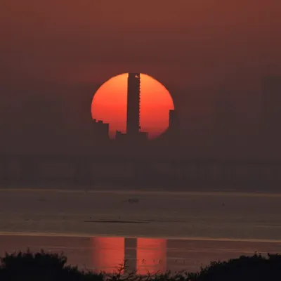 A different kind of Mumbai sunset. I love finding these unique compositions where the setting sun perfectly aligns with the city's architecture, creating a powerful silhouette.