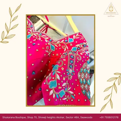 This pink bridal blouse is a true masterpiece, featuring an intricately embroidered peacock motif on the sleeve. The design combines Zardosi, beadwork, and thread embroidery for a rich, textured look.