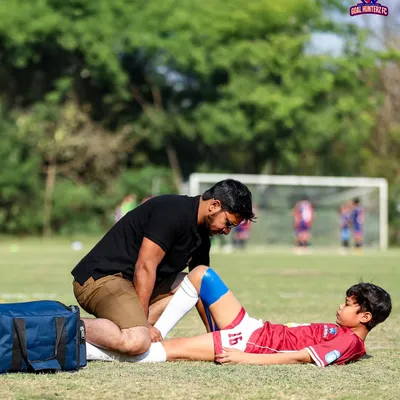 Player safety is our top priority. Our first aid team attending to a young player on the field.