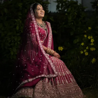 My bride Nandita looking absolutely radiant for her Varamala ceremony. I created a glamorous look with a hint of shimmer on the eyes to match her magnificent maroon lehenga.