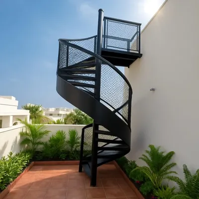 Why use a simple ladder when you can have a statement piece? This custom-built black metal spiral staircase adds a touch of industrial chic and provides stylish access to a rooftop terrace.