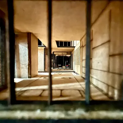 A close-up, eye-level view of the "Heal n Heaven" physical model. This perspective helps us understand the human-scale experience of walking through the building's corridors and spaces.