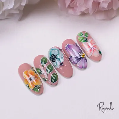 A set of five nails featuring delicate, hand-painted watercolor-style flowers on a soft pink base. I've added tiny crystals for a touch of morning dew.