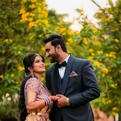 A classic romantic portrait of the couple against a backdrop of beautiful yellow flowers. We look for natural settings that complement your love story.