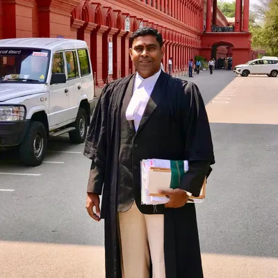 A professional portrait taken outside the High Court. I am equipped to manage the complexities of family law litigation.