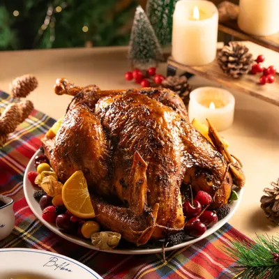 A magnificent roasted turkey for a Christmas feast. This is the quintessential hero shot for any holiday menu.
