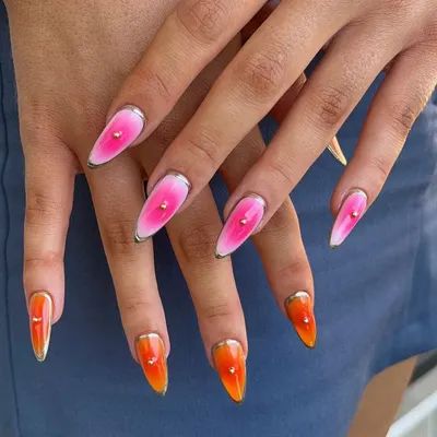 A fiery sunset ombré from orange to pink, finished with a metallic silver outline and a single stud. This look is bold, graphic, and so much fun.