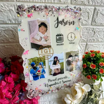This 9x12 inch resin frame is designed to celebrate a new baby. It features the baby's name, birth date, and time, along with a newborn photo and pictures of the proud parents.