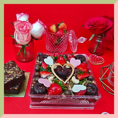 Our Valentine's brownie box is pure indulgence. It's filled with rich, fudgy brownies and lavishly decorated with fresh strawberries, crunchy nuts, and assorted chocolate hearts.