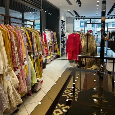 A wide view of our store, showcasing the extensive collection of colorful ethnic wear we offer. From wedding lehengas to formal kurtas, you can browse and find your perfect outfit with us.