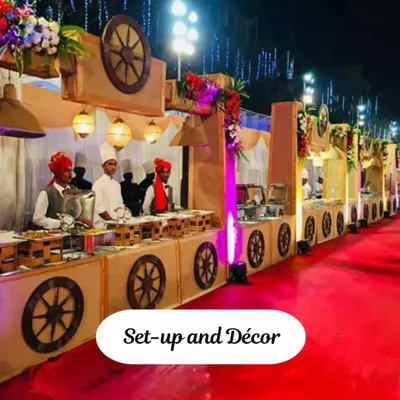 A look at our themed decor for a large festive gathering. The coordinated setup with a red carpet, rustic carts, and staff in traditional attire creates an immersive and celebratory atmosphere for your guests.