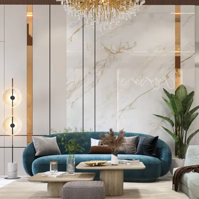 This living room is a masterclass in using accent colors. A bold teal sofa is the centerpiece, set against a backdrop of white marble, gold accents, and a stunning statement chandelier, creating a look of pure luxury.