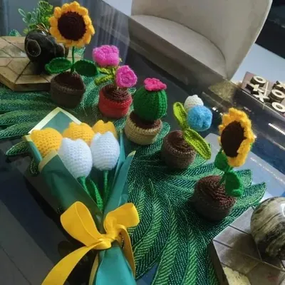 A beautiful photo shared by a happy customer, displaying their new collection of our crochet flowers on their table. We love seeing how you style our pieces!