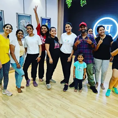 A happy group photo with members of all ages after a fantastic session. This picture captures the inclusive and joyful spirit of our Tap Studio community.