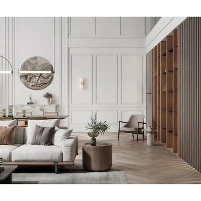 This living room combines classic elegance with modern comfort. We used decorative wall molding, a statement art piece, and a mix of textures to create a refined and inviting space.