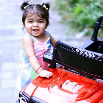A perfect close up portrait of Vaanya during her outdoor birthday session. The soft, natural light and her joyful expression are what make candid kids photography so special. These are the pure, happy moments you'll want to remember.