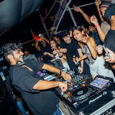 I’m not a DJ who hides behind the decks. I get right in there with the crowd, feeding off their energy. This was at the Fred Again listening party, a packed beachside venue with an unbeatable vibe.