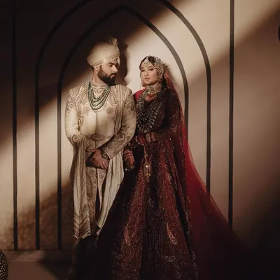 The couple, Bismil and Shifa, in a moment of quiet connection. The decor, with its soft lighting and clean architectural lines, provides a backdrop that is both regal and deeply intimate, reflecting the soulful nature of their union.