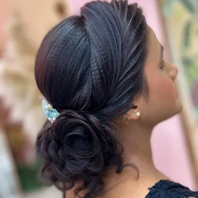 A beautiful and intricate rose bun hairstyle, created as a demonstration for my students. This elegant updo is perfect for a reception or any formal event.