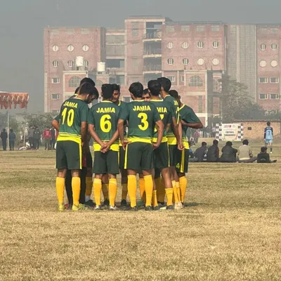 The team huddle before a crucial match. This is where strategy is discussed and morale is boosted. We stand together as one, wearing the Jamia name on our backs with pride.