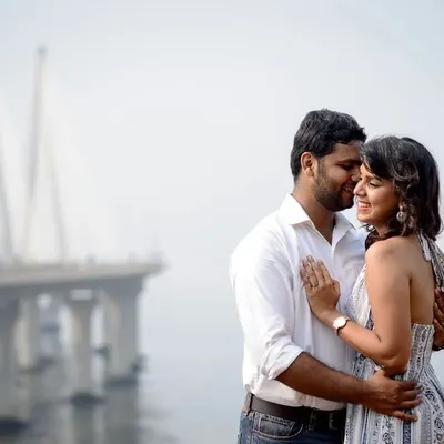 A candid couple portrait with the iconic Bandra Worli Sea Link in the background. I love using familiar cityscapes to create a personal story for couples in Mumbai.