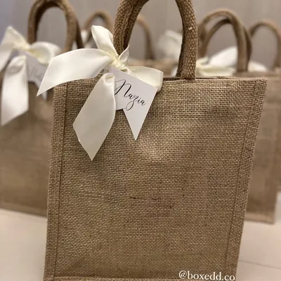 These eco-friendly jute bags are a versatile and stylish option for return gifts. I can personalize them with custom name tags for each of your guests.