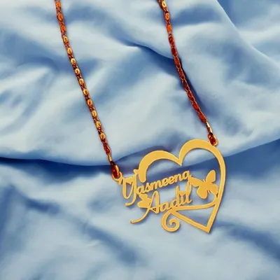This double-name pendant features two names elegantly woven into a heart-shaped frame with a butterfly accent. It’s a popular design for couples, crafted to celebrate your connection.