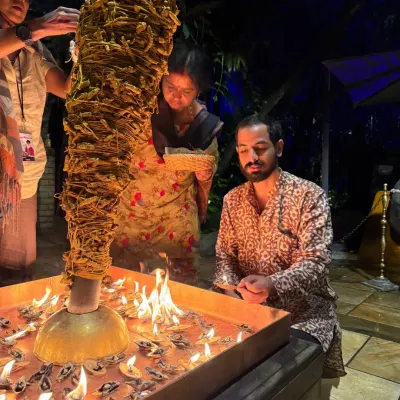 Lighting one of the many diyas during a Devi Abhishekam. Each flame is an offering, a prayer to the Divine Feminine, illuminating the space with devotion.