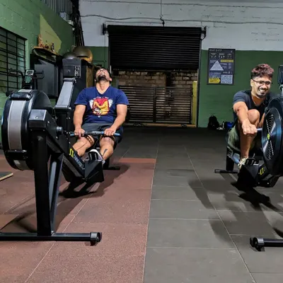 Two members deep in the pain cave on the rowing machines. Self-respect leads to self-discipline, and workouts like this build both. It's about pushing your limits and finding real power within.