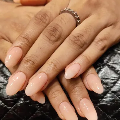 The beauty of a perfectly shaped, natural-looking nude extension. This is the ultimate "your nails but better" look.