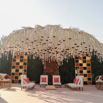 The 'Kalpavṛkṣa' or wish-fulfilling tree mandap, a concept we brought to life for a spiritual ceremony. The canopy is made of thousands of hand-strung tuberose and marigold garlands, creating a divine covering.