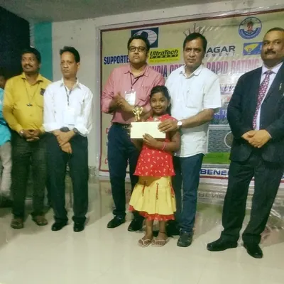 My student Shivani with her first-place trophy and cash prize at the All India Open Fide Rapid Rating Chess Tournament 2021. Our tournament preparation focuses on achieving success at the highest levels.