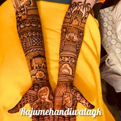 Here, the bride and groom portraits are the main focus on the palms. The design extends up the arms with traditional elements like elephants and palace architecture, creating a complete story.