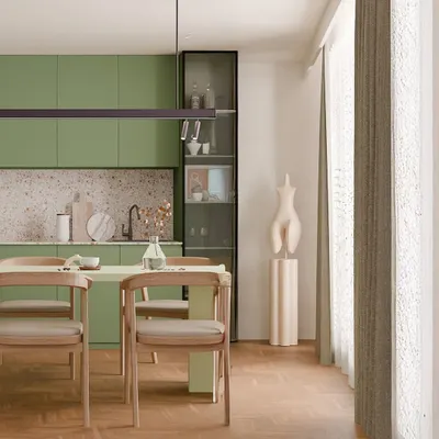 This olive-toned kitchen blends modern utility with earthy calm. The terrazzo backsplash and sleek, handleless cabinets create a clean look, while the adjoining dining area with natural wood textures makes it a cozy spot for everyday meals.