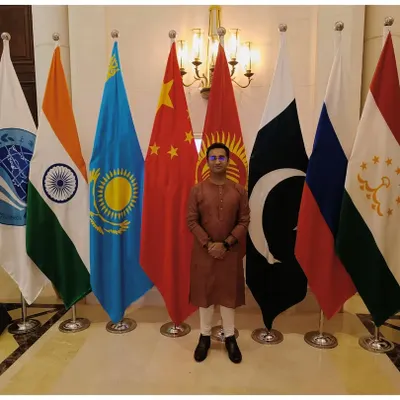 Standing with the flags of the member nations at a G20 event in New Delhi. I provide musical services for high-profile government and diplomatic functions.