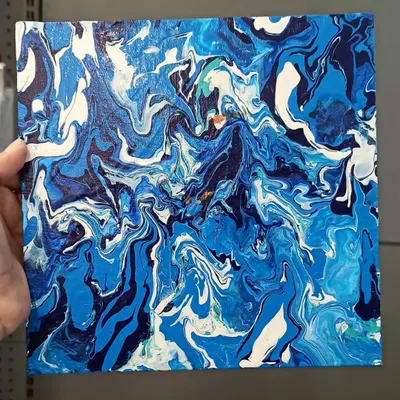 This piece was created using the fluid art technique, where I pour and manipulate liquid acrylics on canvas. The result is a unique, organic pattern reminiscent of ocean waves.