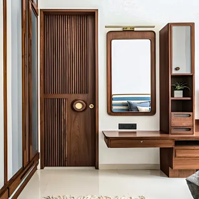 We designed this bedroom with custom woodwork, including a fluted wooden door and an integrated dressing unit. The floating vanity table and matching storage cabinet provide a dedicated space for getting ready, all in a cohesive, elegant style.